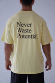 Camiseta Oversize Never Waste Potential Amarilla