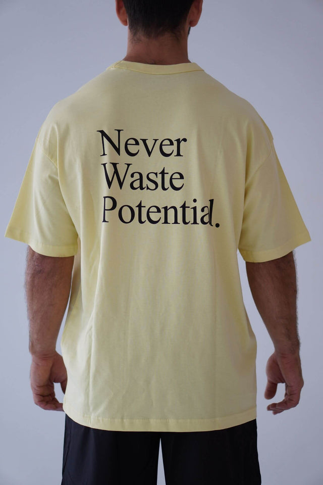 Camiseta Oversize Never Waste Potential Amarilla